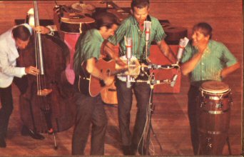 The Kingston Trio on stage.